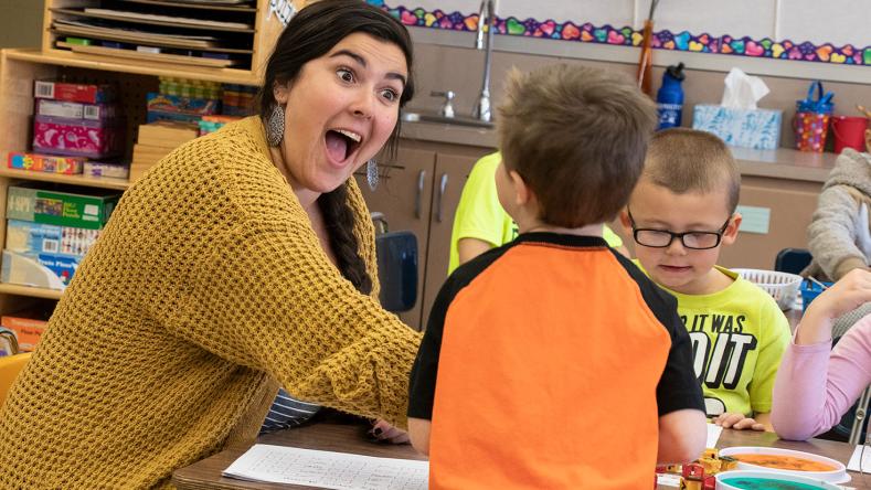 Elementary education teacher with students