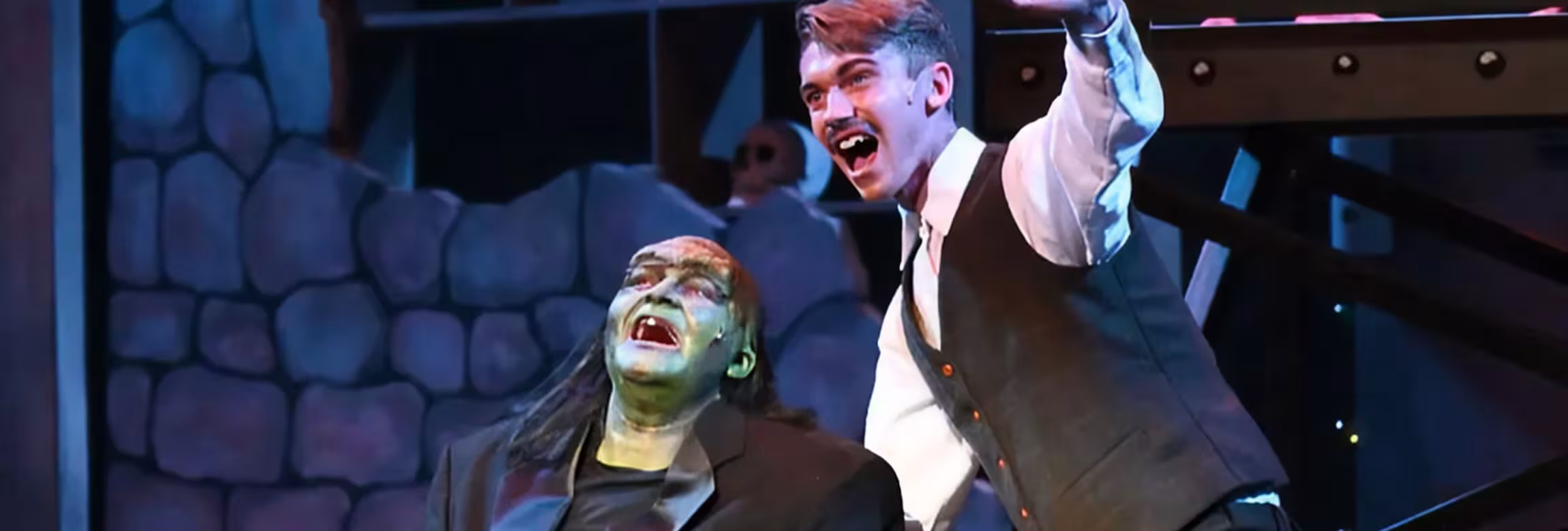 production image - two actors on stage close up